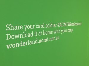 Graphic of the words Share your card soldier on the wall.