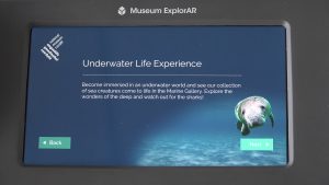 picture of a mobile screen explaining the Underwater Life experience and a picture of a manatee